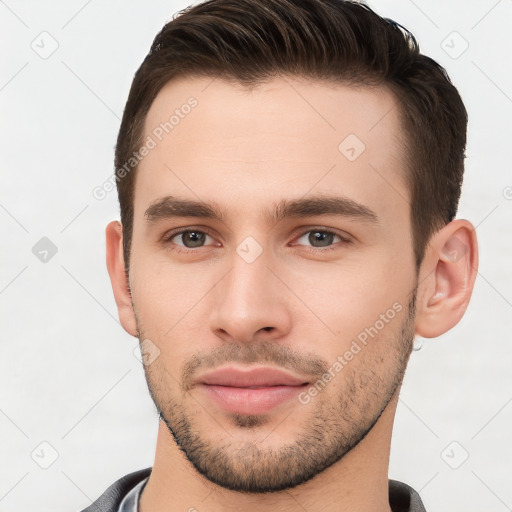 Neutral white young-adult male with short  brown hair and brown eyes