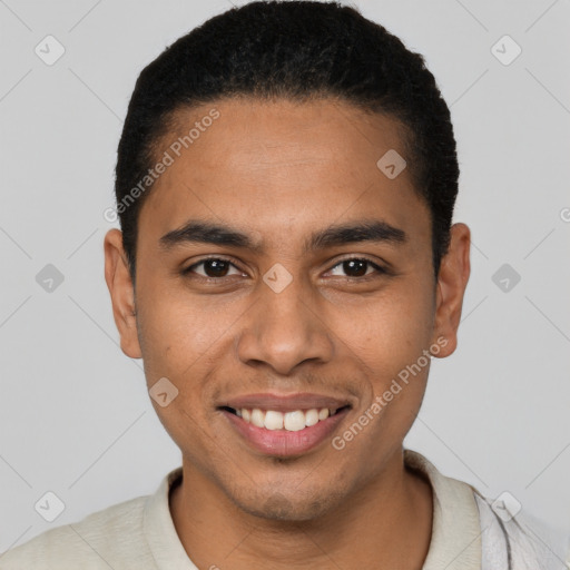 Joyful latino young-adult male with short  black hair and brown eyes