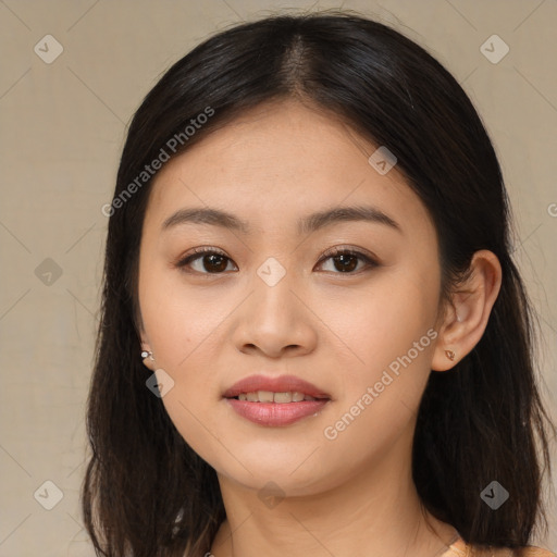 Joyful asian young-adult female with long  brown hair and brown eyes