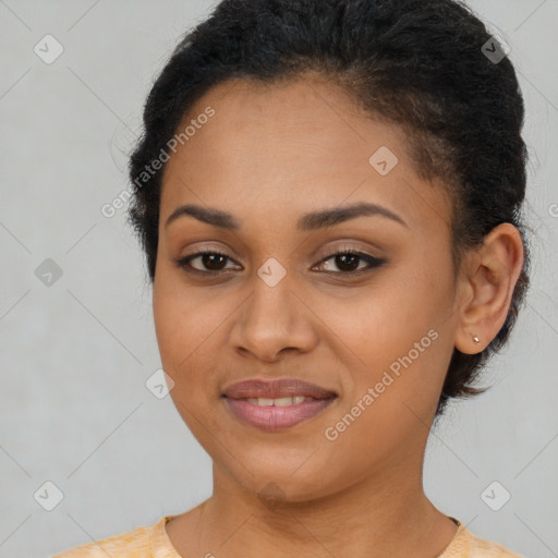 Joyful black young-adult female with short  brown hair and brown eyes