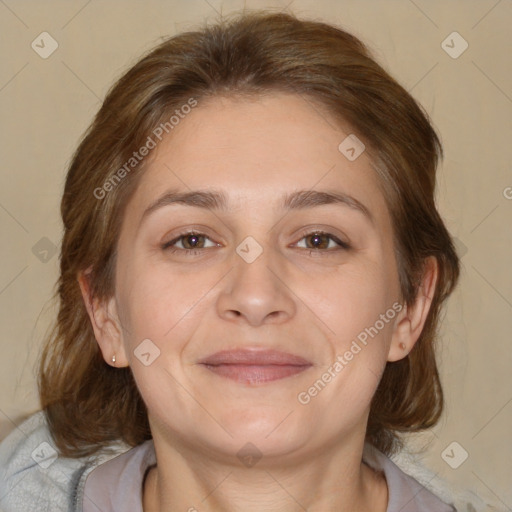 Joyful white adult female with medium  brown hair and brown eyes