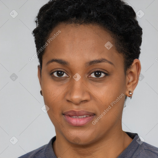 Joyful black young-adult female with short  black hair and brown eyes