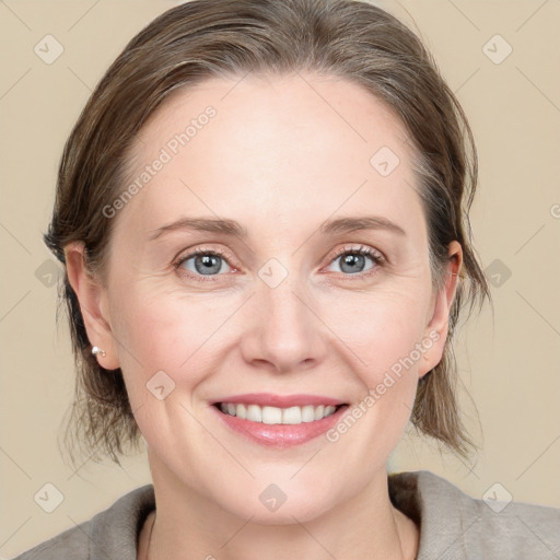 Joyful white young-adult female with medium  brown hair and blue eyes