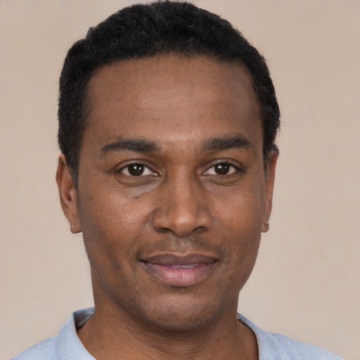Neutral black adult male with short  black hair and brown eyes