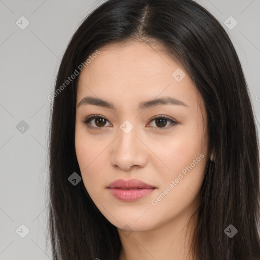 Joyful asian young-adult female with long  brown hair and brown eyes