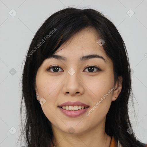 Joyful asian young-adult female with long  brown hair and brown eyes