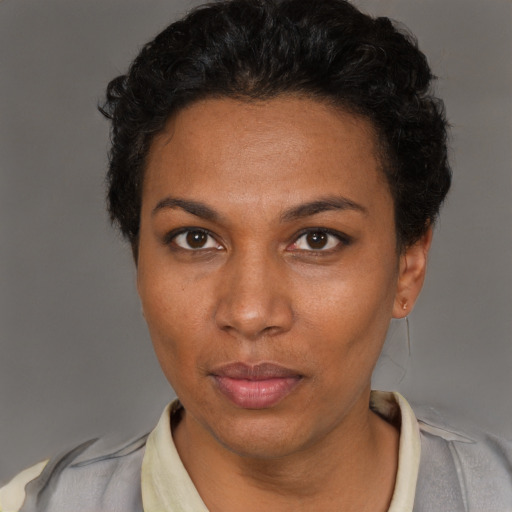 Neutral black adult female with short  brown hair and brown eyes