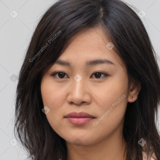 Joyful asian young-adult female with long  brown hair and brown eyes