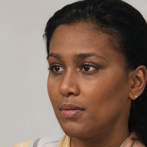 Neutral black young-adult female with short  black hair and brown eyes