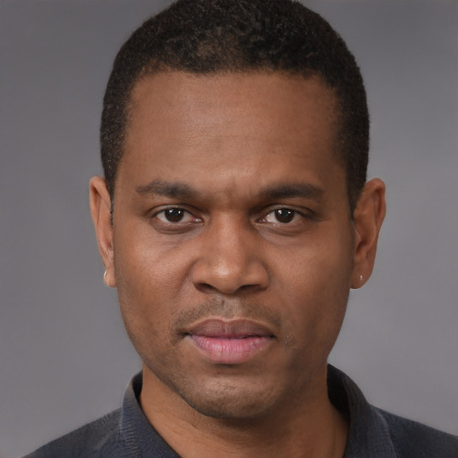 Neutral black adult male with short  black hair and brown eyes