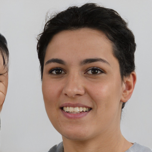 Joyful asian young-adult female with short  brown hair and brown eyes