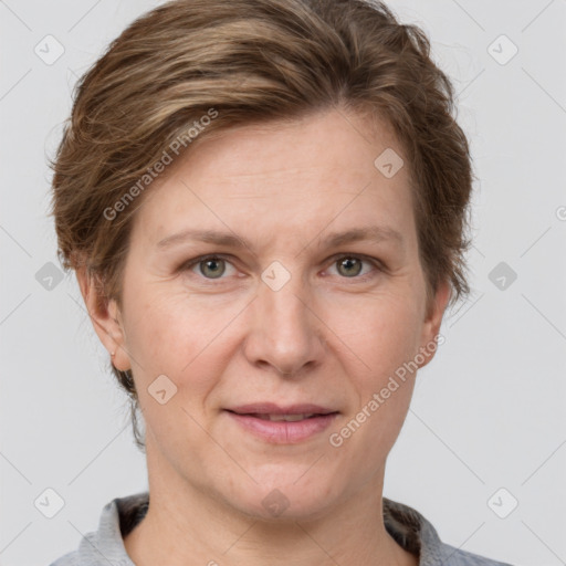 Joyful white adult female with short  brown hair and grey eyes