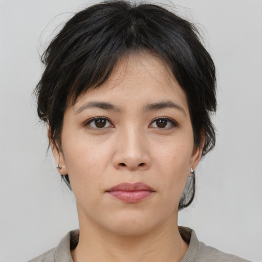 Neutral asian young-adult female with medium  brown hair and brown eyes