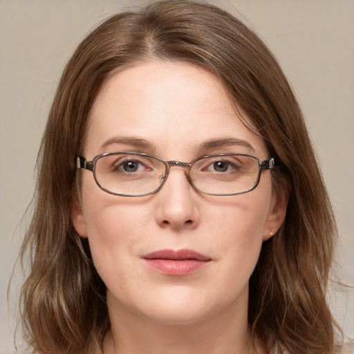 Joyful white adult female with medium  brown hair and grey eyes