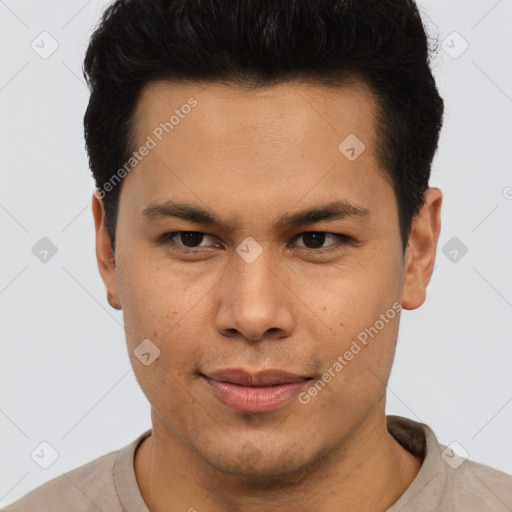 Joyful latino young-adult male with short  brown hair and brown eyes