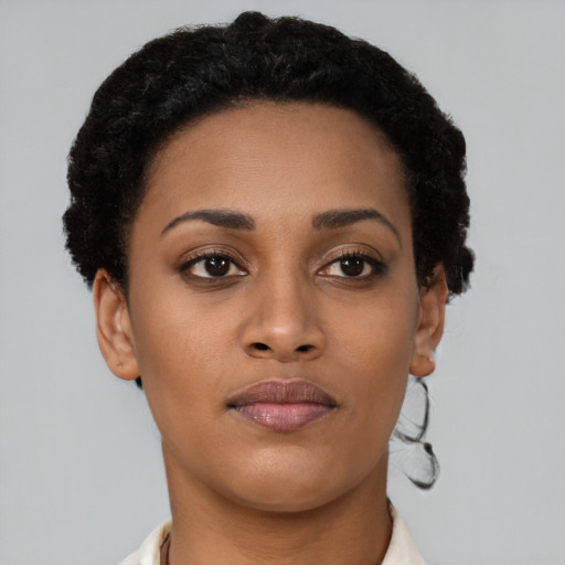 Neutral black young-adult female with short  brown hair and brown eyes