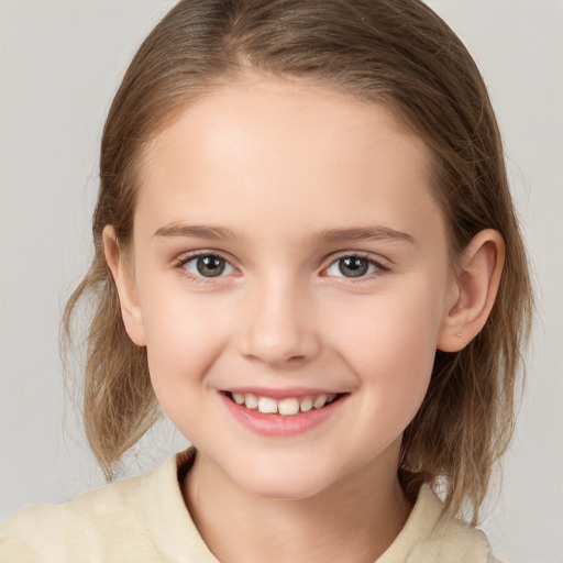 Joyful white child female with medium  brown hair and brown eyes