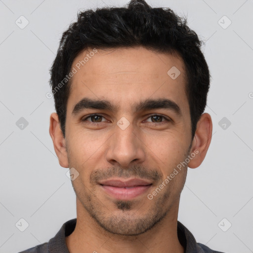 Joyful white young-adult male with short  black hair and brown eyes