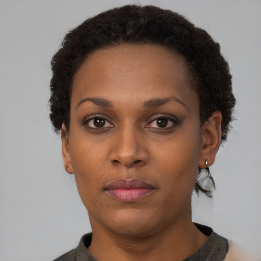 Neutral black young-adult female with short  brown hair and brown eyes