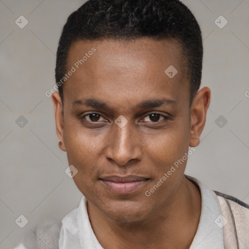 Joyful black young-adult male with short  black hair and brown eyes