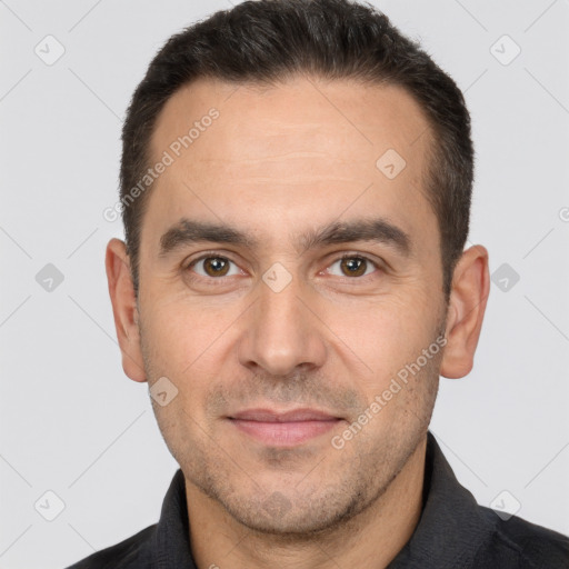 Joyful white adult male with short  brown hair and brown eyes