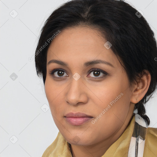 Joyful latino young-adult female with medium  brown hair and brown eyes