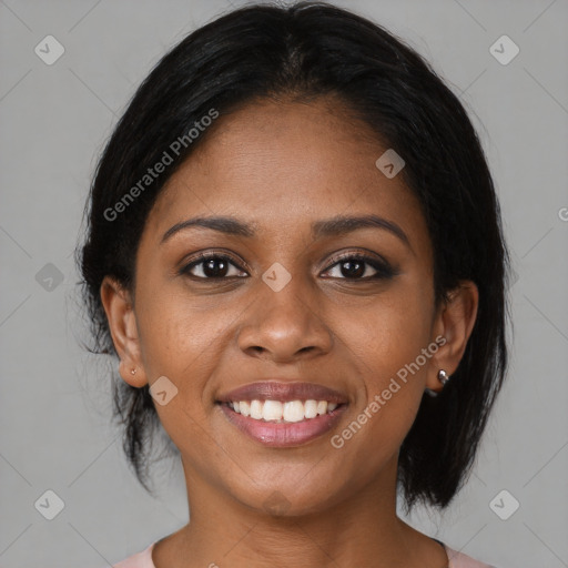 Joyful black young-adult female with medium  brown hair and brown eyes