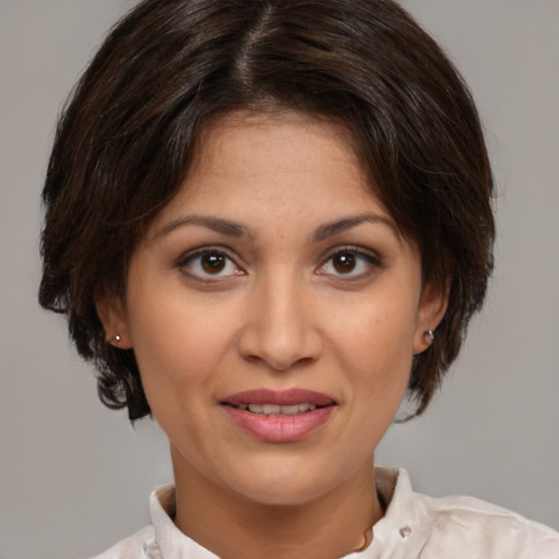 Joyful white young-adult female with medium  brown hair and brown eyes