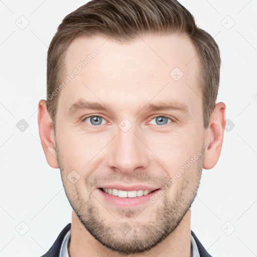 Joyful white young-adult male with short  brown hair and grey eyes