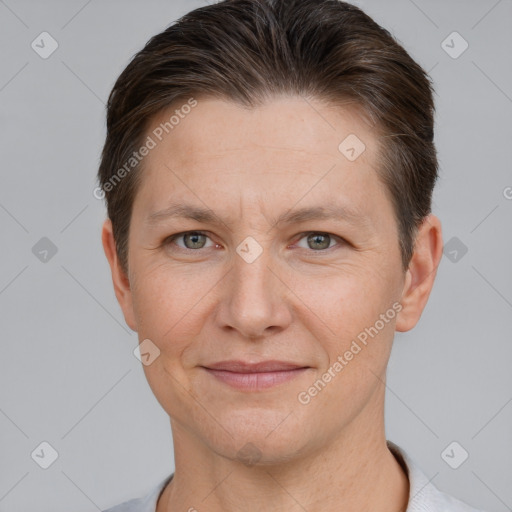 Joyful white adult female with short  brown hair and brown eyes