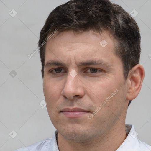 Neutral white adult male with short  brown hair and brown eyes