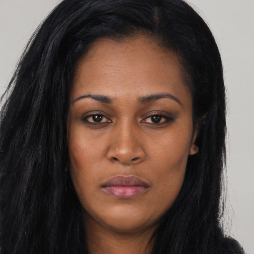 Joyful asian young-adult female with long  black hair and brown eyes