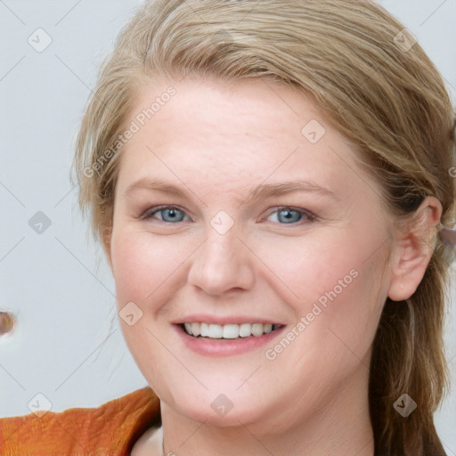 Joyful white young-adult female with medium  brown hair and blue eyes