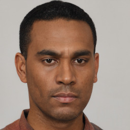 Neutral latino young-adult male with short  black hair and brown eyes