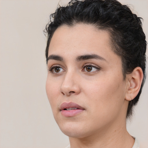 Neutral white young-adult female with short  black hair and brown eyes