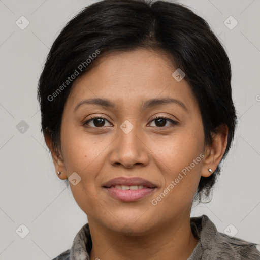 Joyful latino young-adult female with medium  brown hair and brown eyes