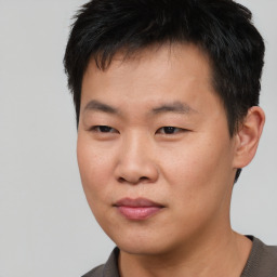 Neutral asian young-adult male with short  black hair and brown eyes