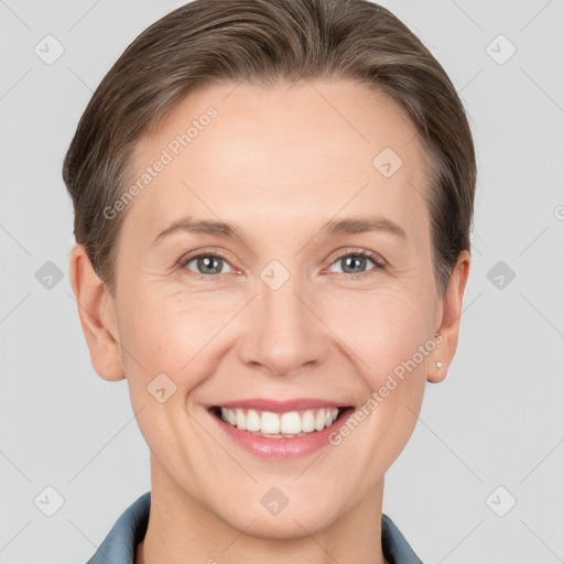 Joyful white adult female with short  brown hair and grey eyes