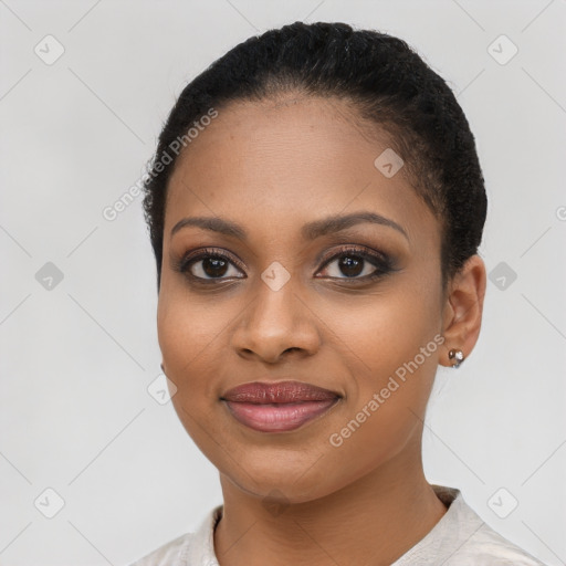 Joyful black young-adult female with short  brown hair and brown eyes