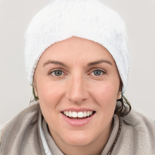 Joyful white young-adult female with medium  black hair and blue eyes