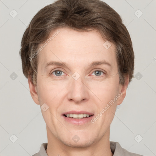 Joyful white adult male with short  brown hair and grey eyes