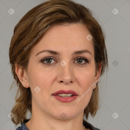 Joyful white adult female with medium  brown hair and blue eyes