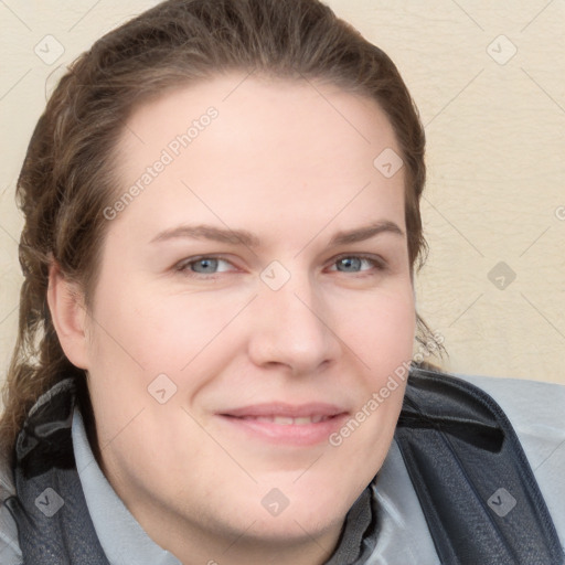 Joyful white young-adult female with long  brown hair and blue eyes