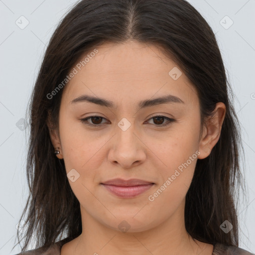 Joyful asian young-adult female with long  brown hair and brown eyes