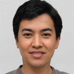 Joyful asian young-adult male with short  black hair and brown eyes