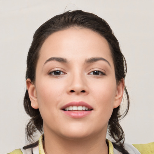 Joyful white young-adult female with medium  brown hair and brown eyes