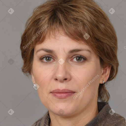 Joyful white adult female with medium  brown hair and grey eyes