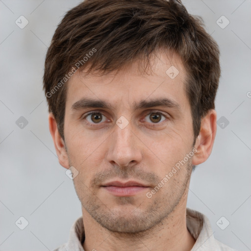 Neutral white young-adult male with short  brown hair and brown eyes