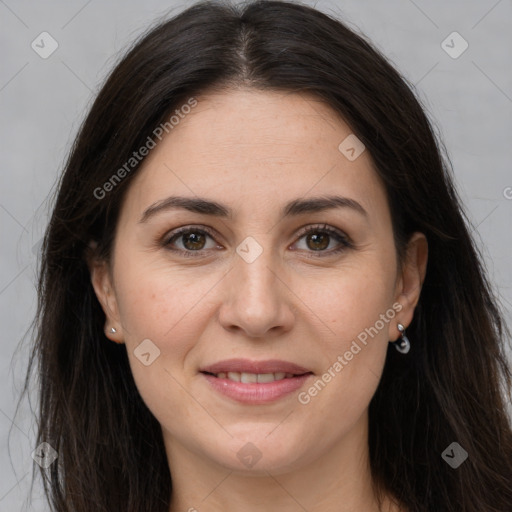 Joyful white adult female with long  brown hair and brown eyes