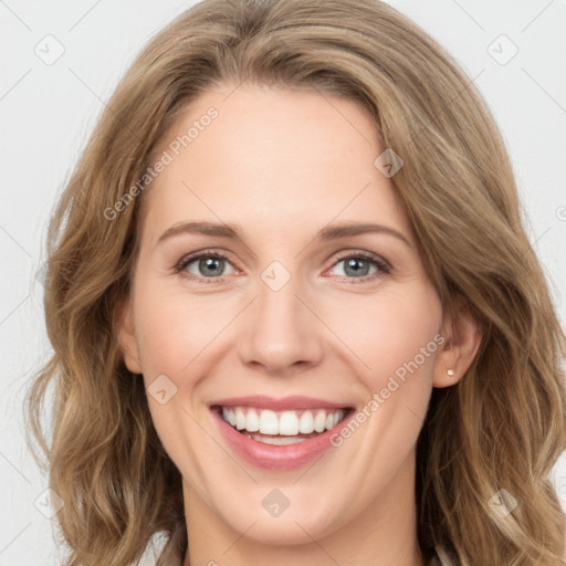 Joyful white young-adult female with long  brown hair and green eyes